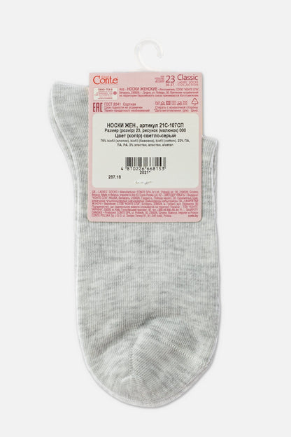 Light grey women's ankle socks are displayed flat with a paper label attached to the top showing product details and a barcode.