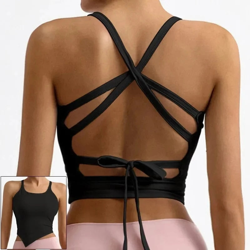 A black athletic crop top features a backless design with thin crisscross straps and a tie-back closure, shown from both the back and the front.