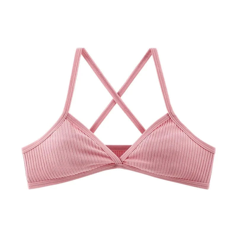 A light pink ribbed bralette featuring a deep V-neckline and crisscross shoulder straps.