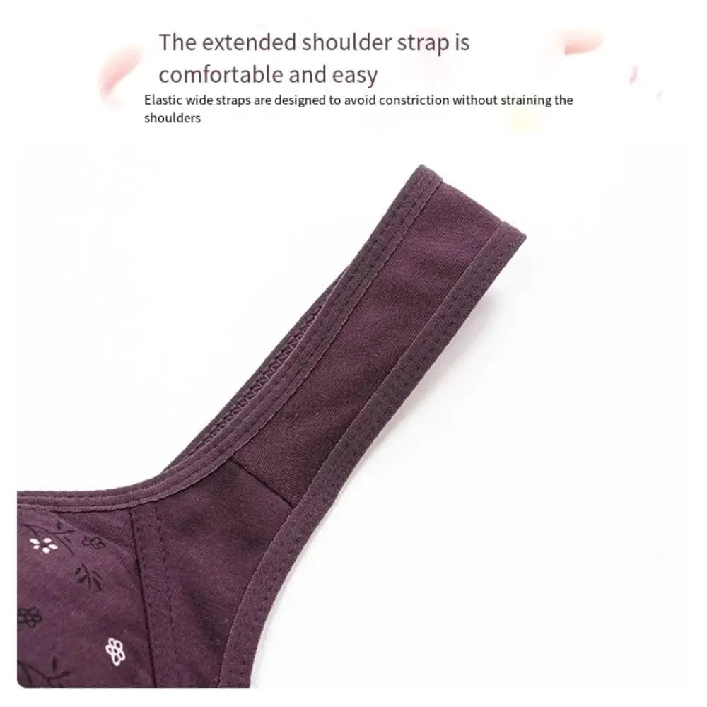 A close-up view of a wide, dark purple bra shoulder strap featuring a floral pattern on the connected cup area against a white background.
