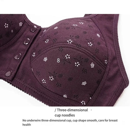 A purple floral print bra with a front button closure and a contoured, three-dimensional cup design.