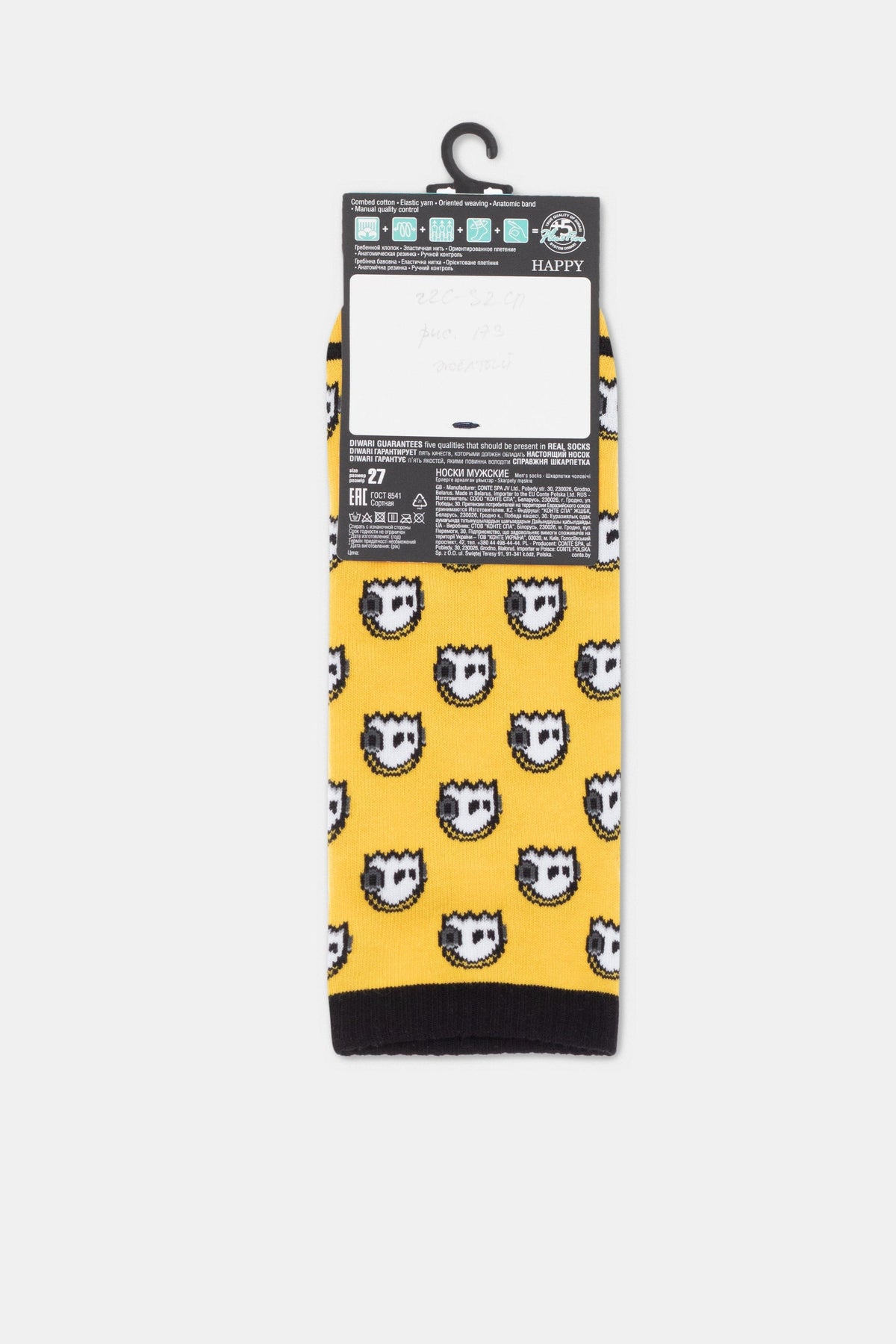 A pair of yellow crew socks featuring a repeating pattern of white and black cartoon-style faces, with a black cuff and toe area and a tag attached at the top.