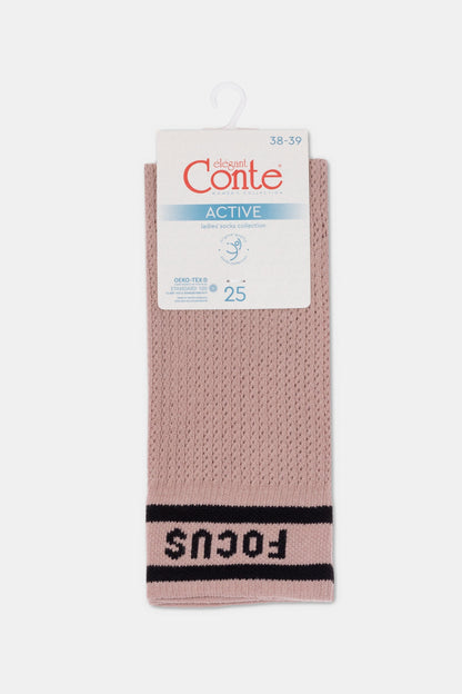 Dusty pink ankle socks with a textured mesh weave, featuring two horizontal black stripes and the word FOCUS written in black lettering near the toe.
