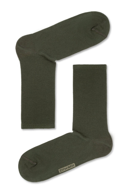 A pair of olive green crew-length socks featuring a small rectangular label with text branding near the toe on a plain white background.