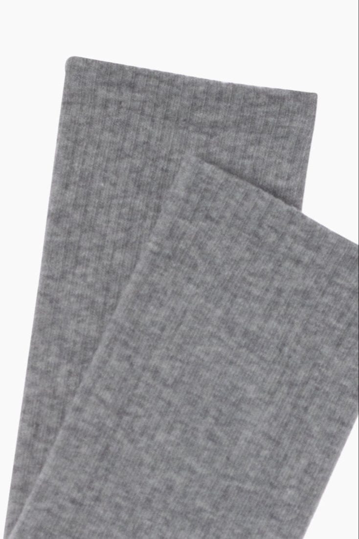 A pair of folded grey socks featuring a ribbed texture.