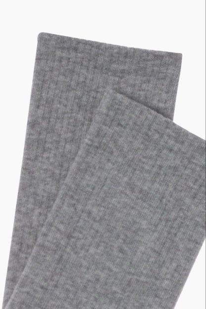 A pair of folded grey socks featuring a ribbed texture.