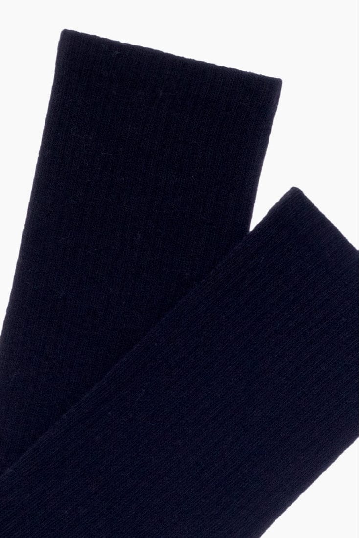 A pair of folded dark navy blue socks shown against a plain white background.