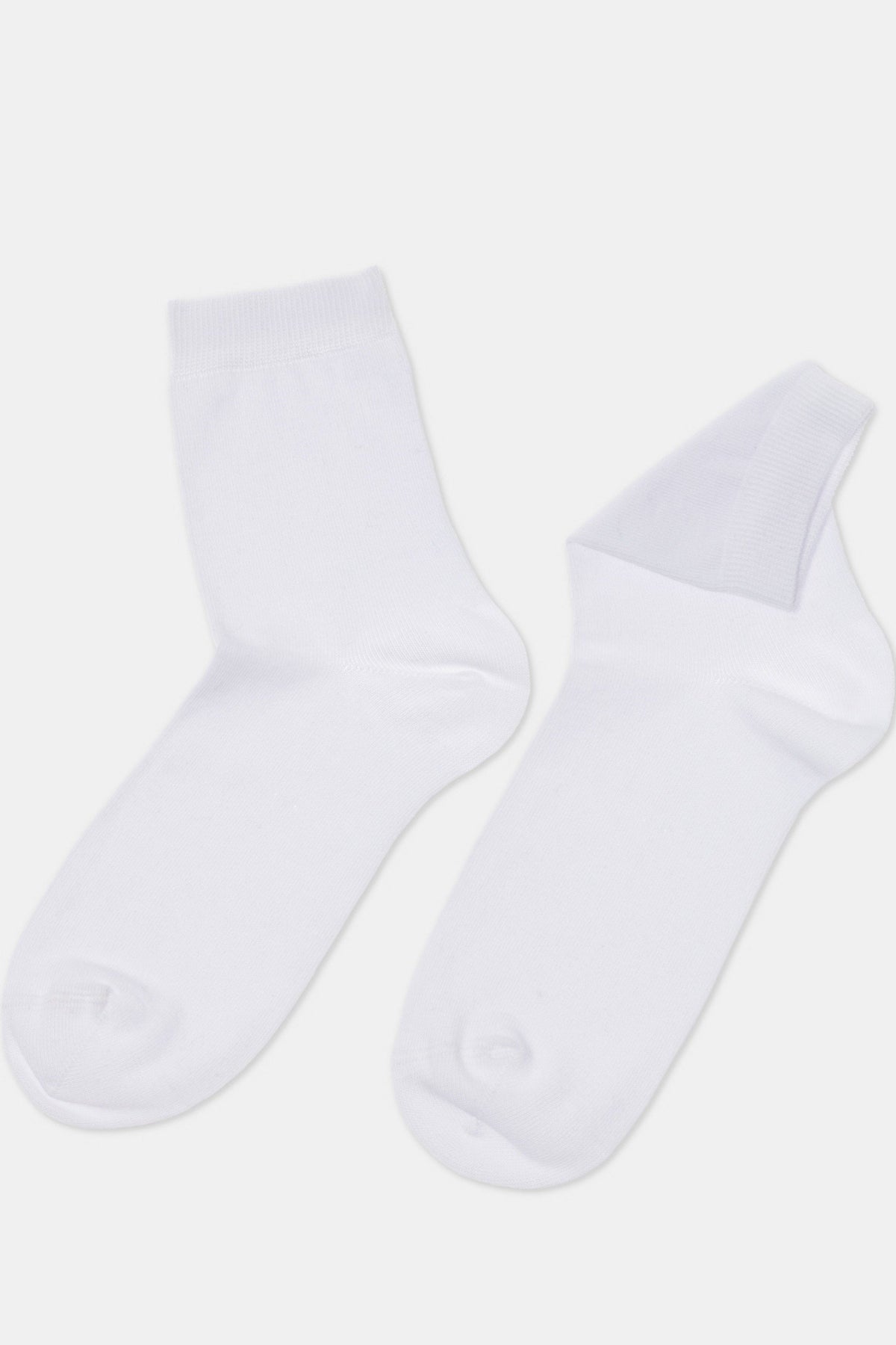 A pair of plain white ankle-length socks displayed against a light grey background.
