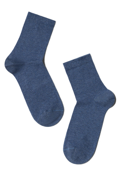 A pair of crew-length socks in a heathered denim blue fabric laid out against a plain white background.