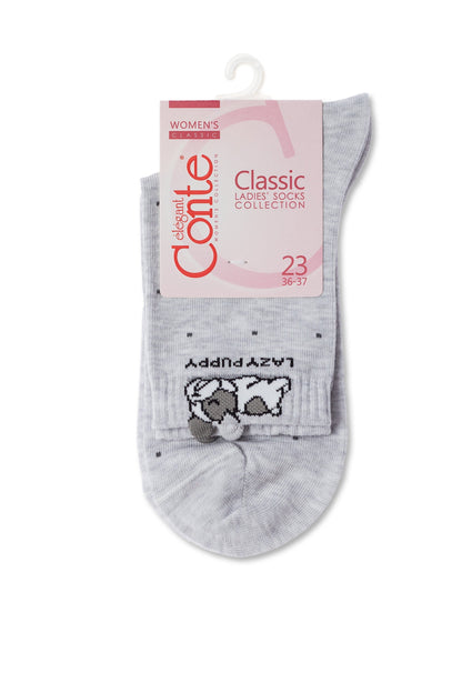 A pair of grey ankle socks with a small black and white puppy illustration and the word LAZY PUPPY printed on the cuff, hanging from a branded product tag.