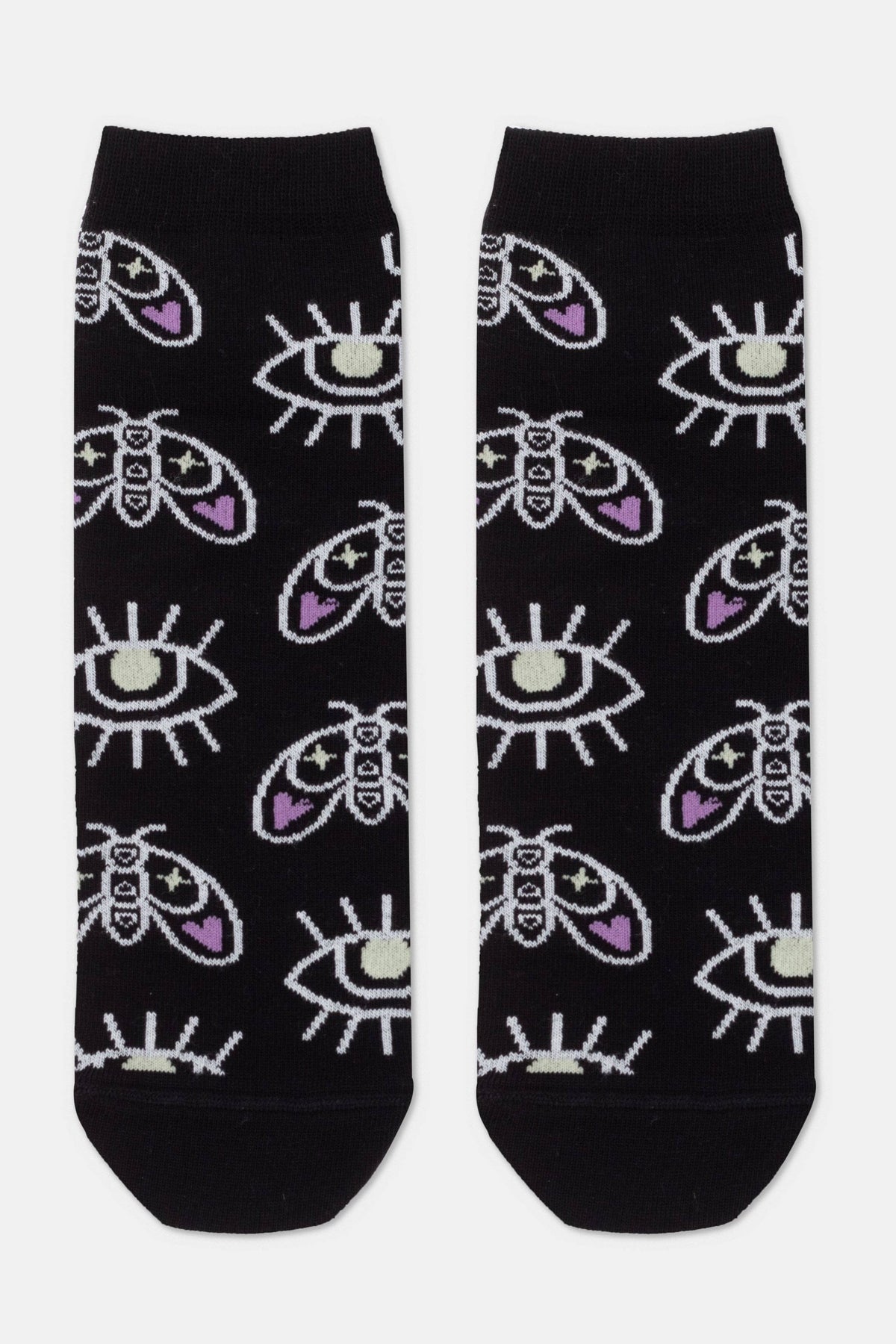 A pair of black crew socks featuring an all-over pattern of white moths with purple accents and stylized white eyes.