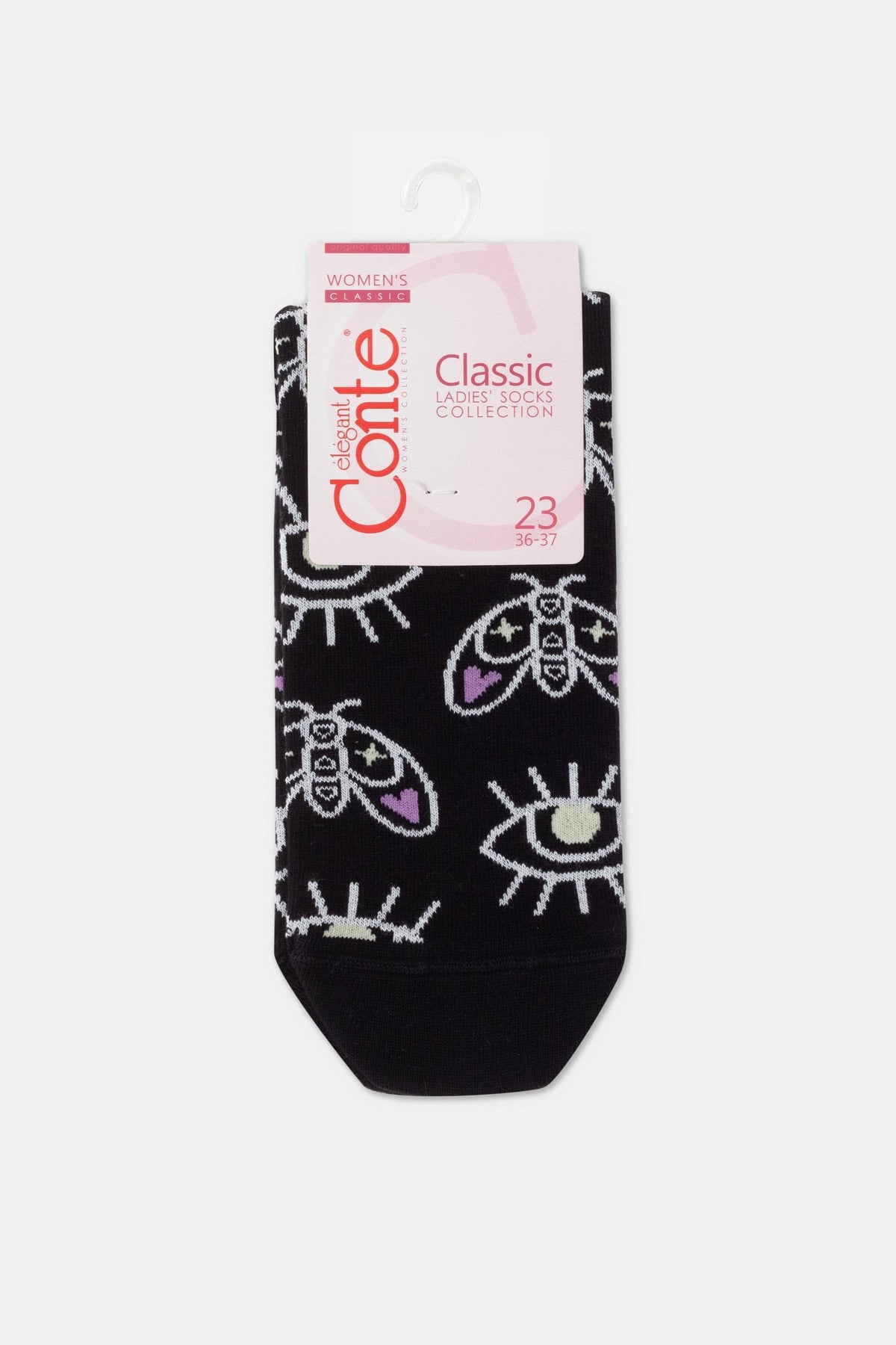 A pair of black women's ankle socks featuring a repeating pattern of white moth and eye graphics, displayed on a cardboard hanger.