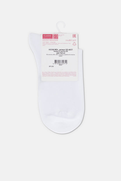 A pair of white ankle socks hanging on a plastic hook with a product information label attached to the top.