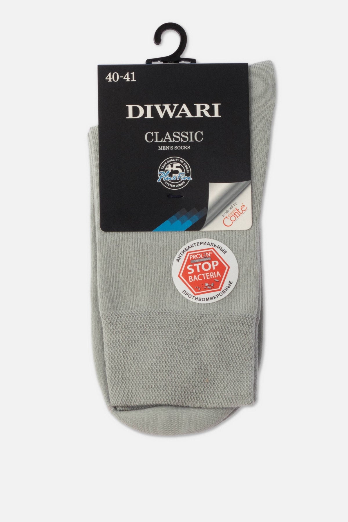 A pair of folded light grey men's socks attached to a black cardboard header card with branding and a circular sticker indicating anti-bacterial properties.