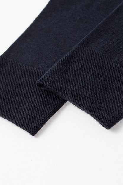 Two dark navy blue fabric cuffs featuring a fine, ribbed knit texture shown against a plain white background.