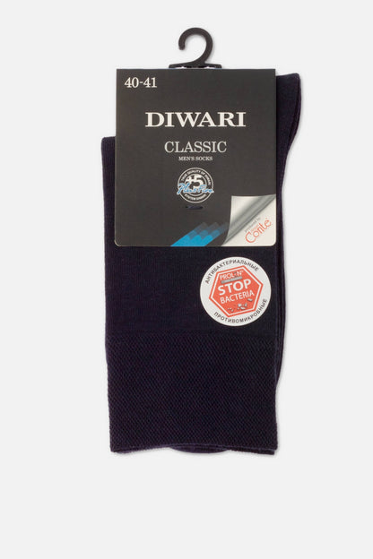 A pair of dark purple men's socks folded on a cardboard header card with white labels and an antibacterial stop bacteria sticker.