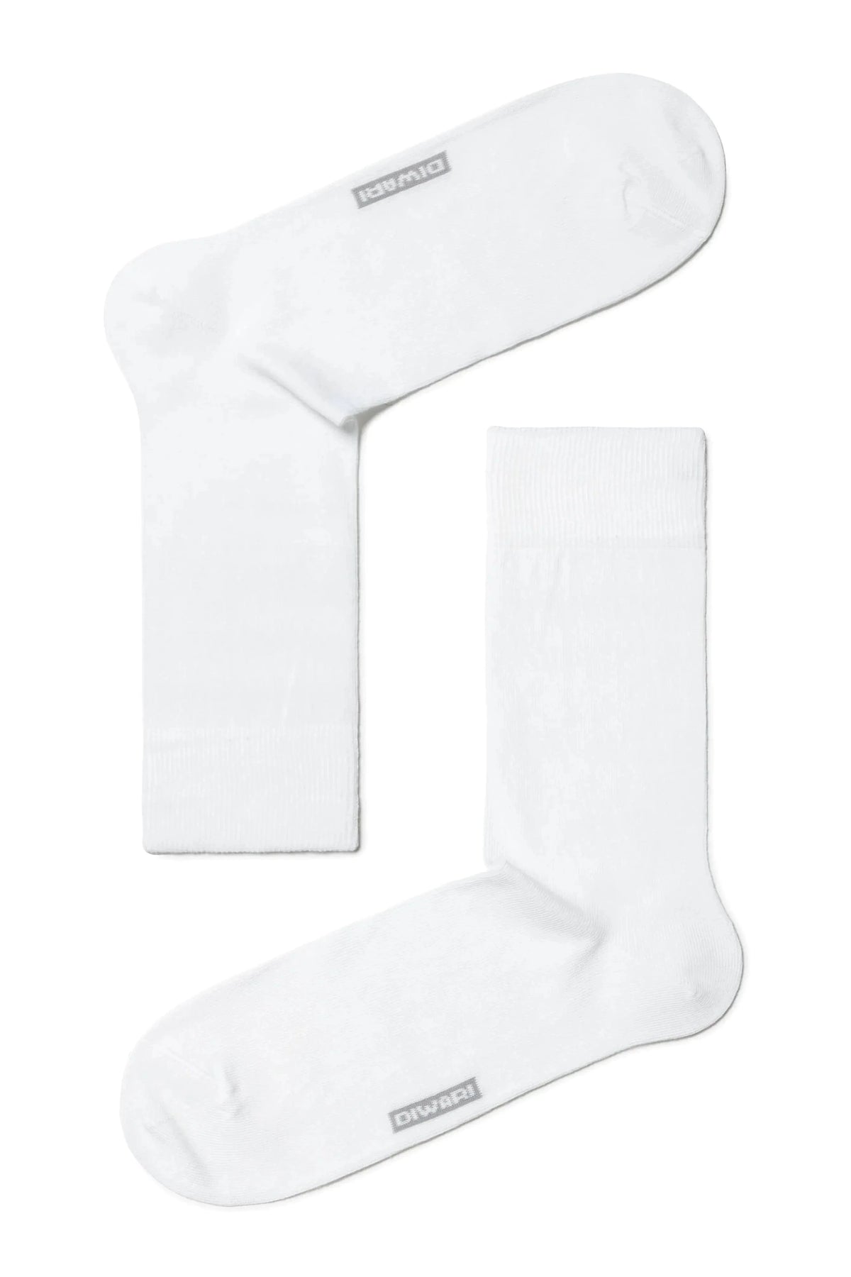 A pair of plain white crew-length socks are arranged on a white background with the word Diwari printed on the sole of each.