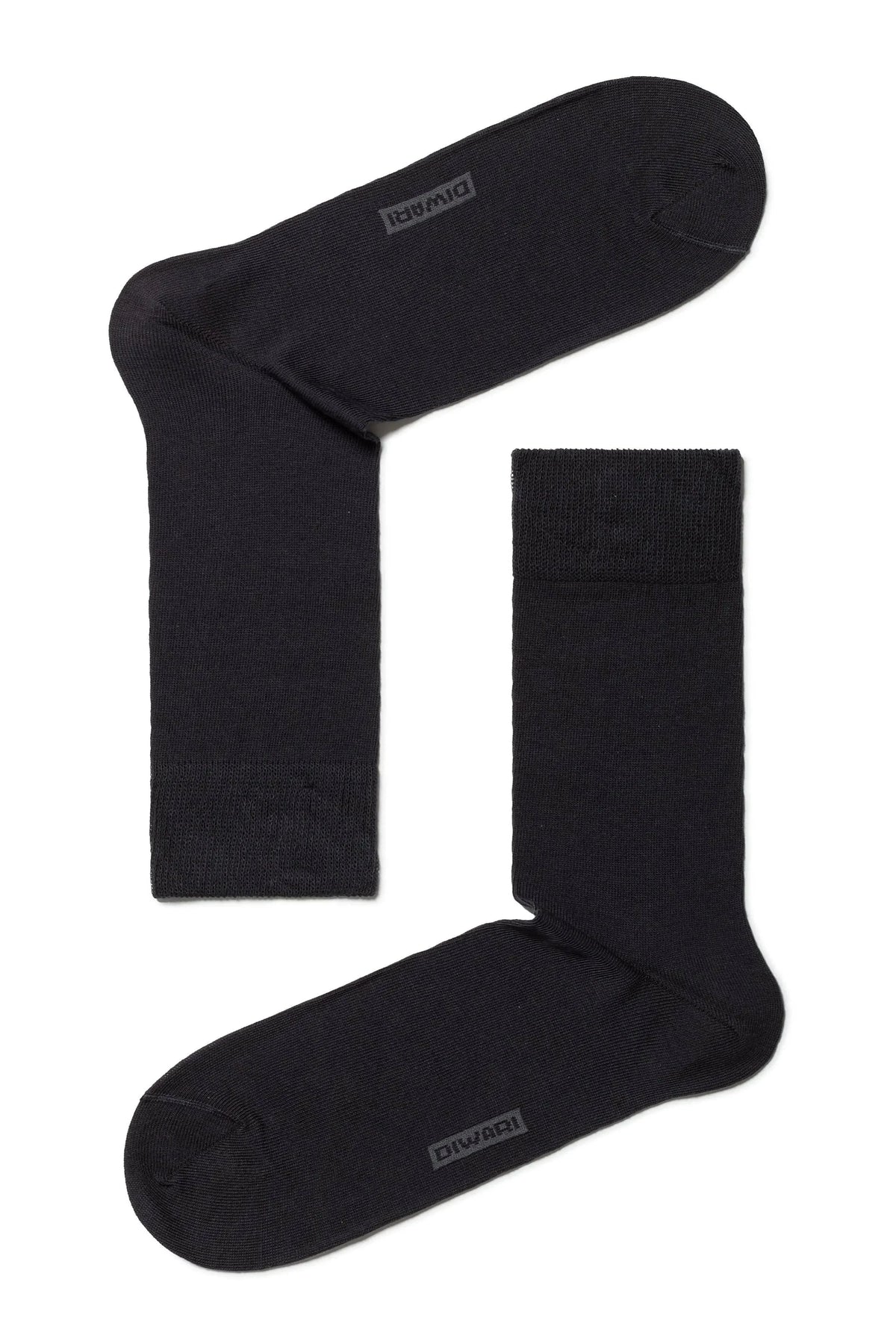 A pair of black crew-length socks featuring a subtle branded logo detail near the toe area, presented against a plain white background.