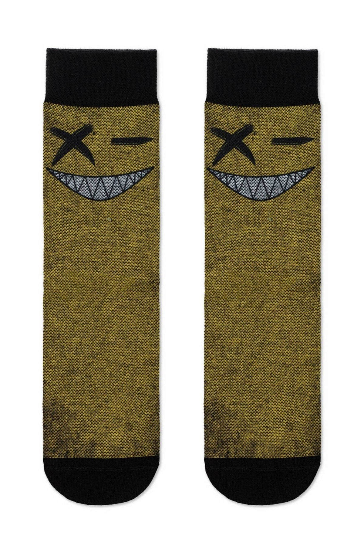 A pair of crew-length socks in a textured mustard yellow, each featuring a black-and-white graphic of a winking face with an x-shaped eye and a wide, toothy grin.