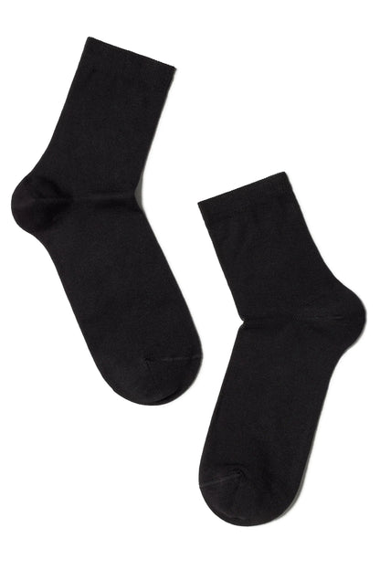 A pair of solid black crew socks shown against a plain white background.