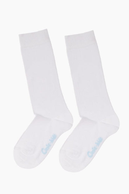 A pair of plain white crew-length socks with light blue text branding on the instep.