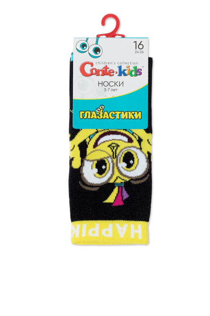 A pair of black children's socks featuring a large upside-down cartoon character face with wide eyes and yellow details, displayed on a branded product header card.