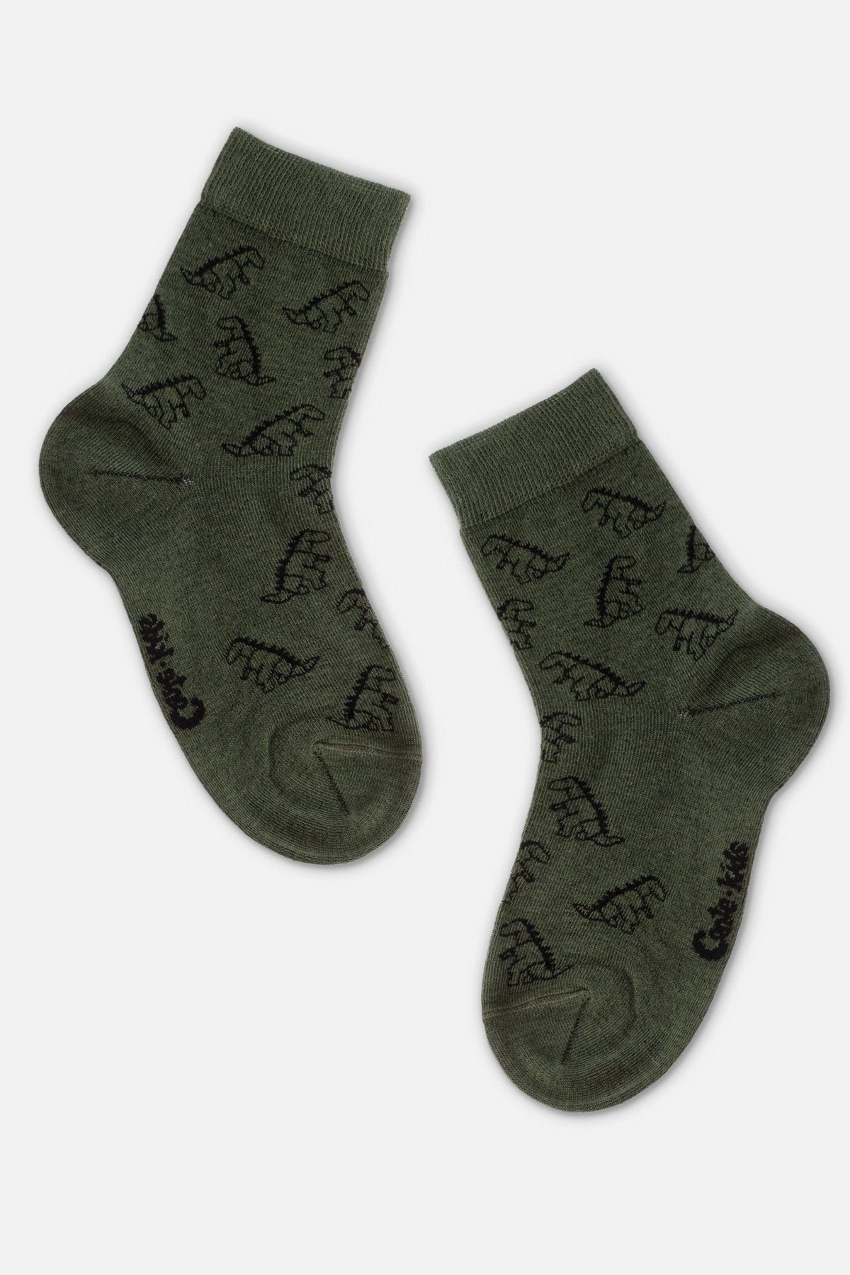 A pair of olive green crew socks decorated with a repeating pattern of small black dinosaur silhouettes.
