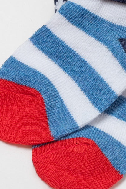 A pair of folded socks featuring horizontal white and blue stripes with bright red toe sections against a plain white background.