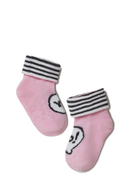A pair of pink baby socks featuring black and white striped cuffs and a white circular skull graphic on the front of each sock.