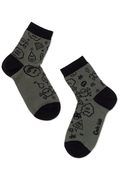 A pair of olive green crew-length socks with black heels, toes, and cuffs featuring a repeating pattern of black outlines of skulls, clouds, lightning bolts, and other small icons, with the brand name Conte-kids printed on the side.