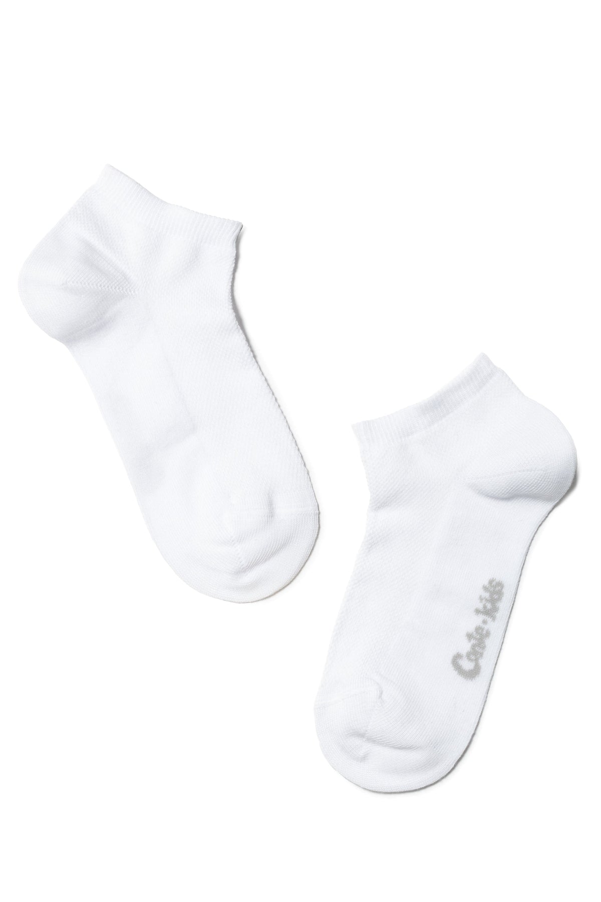 A pair of white ankle socks positioned diagonally on a white background, with a small grey brand logo printed on the side of one sock.