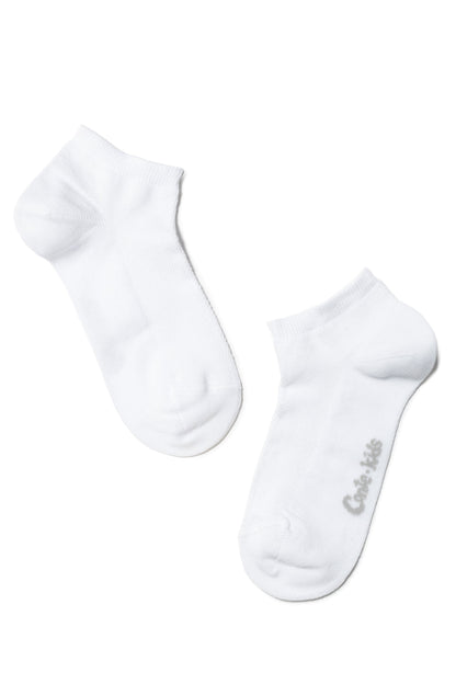 A pair of white ankle socks positioned diagonally on a white background, with a small grey brand logo printed on the side of one sock.