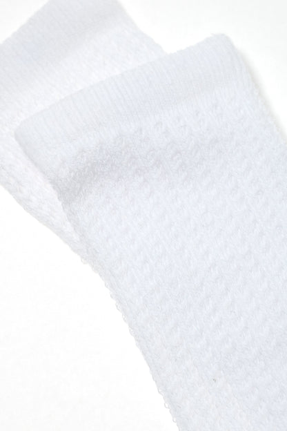 A pair of folded white athletic socks with a textured, ribbed fabric design shown against a plain white background.