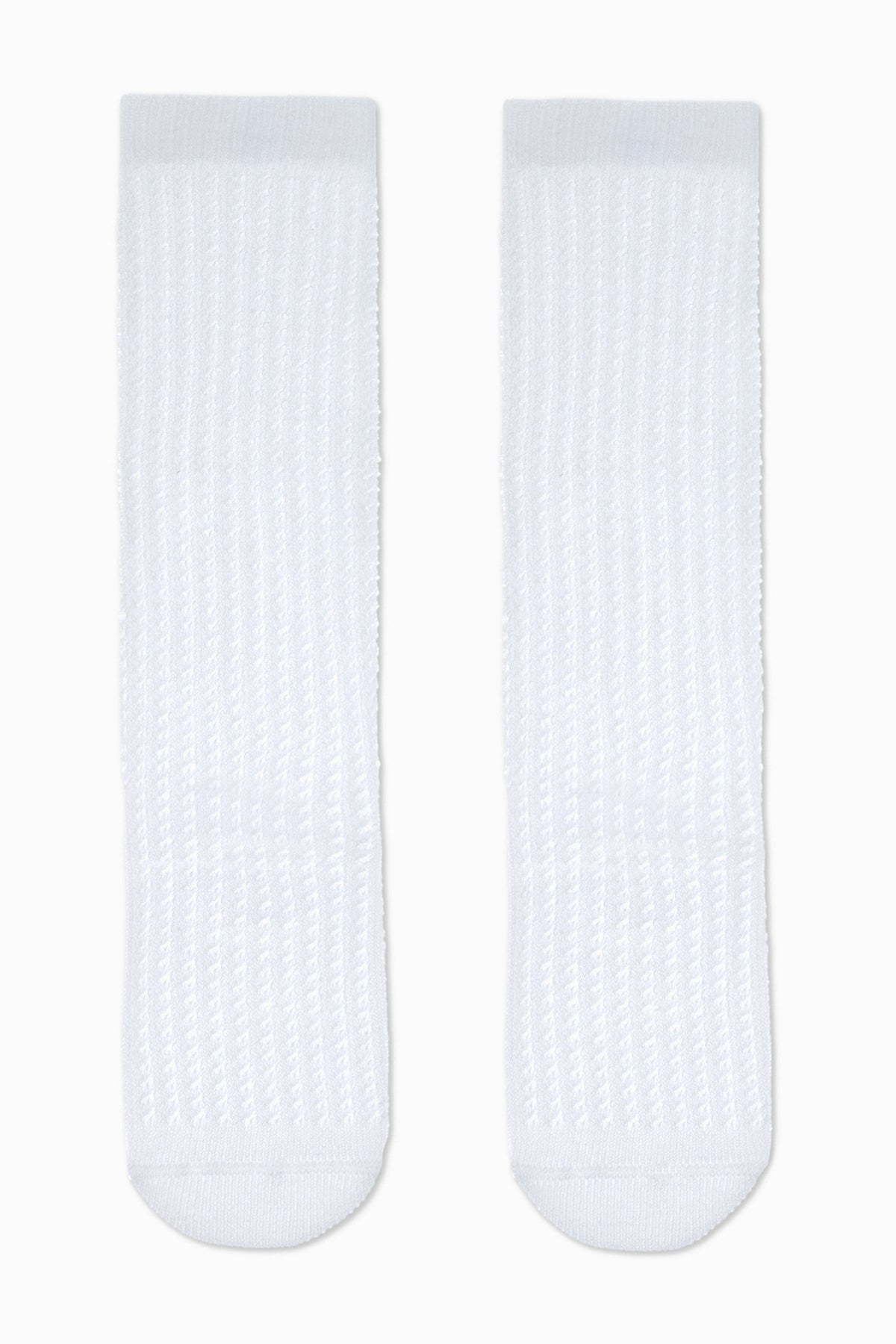 A pair of white, ribbed knee-high socks laid out flat against a plain white background.