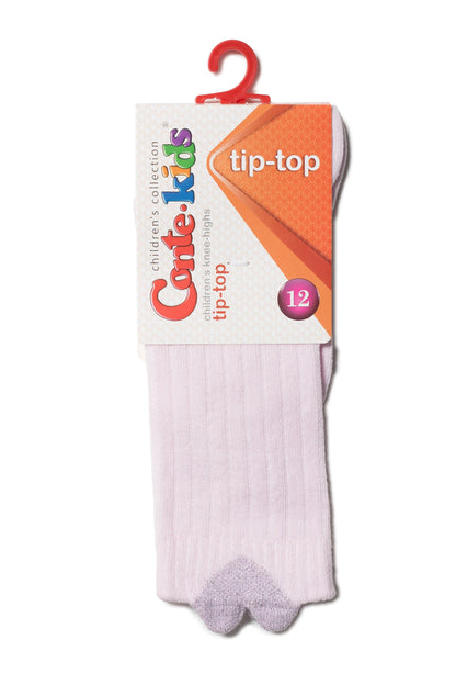 A pair of light pink knee-high socks with a glittery silver heart-shaped design at the toe, hanging from a branded display card.