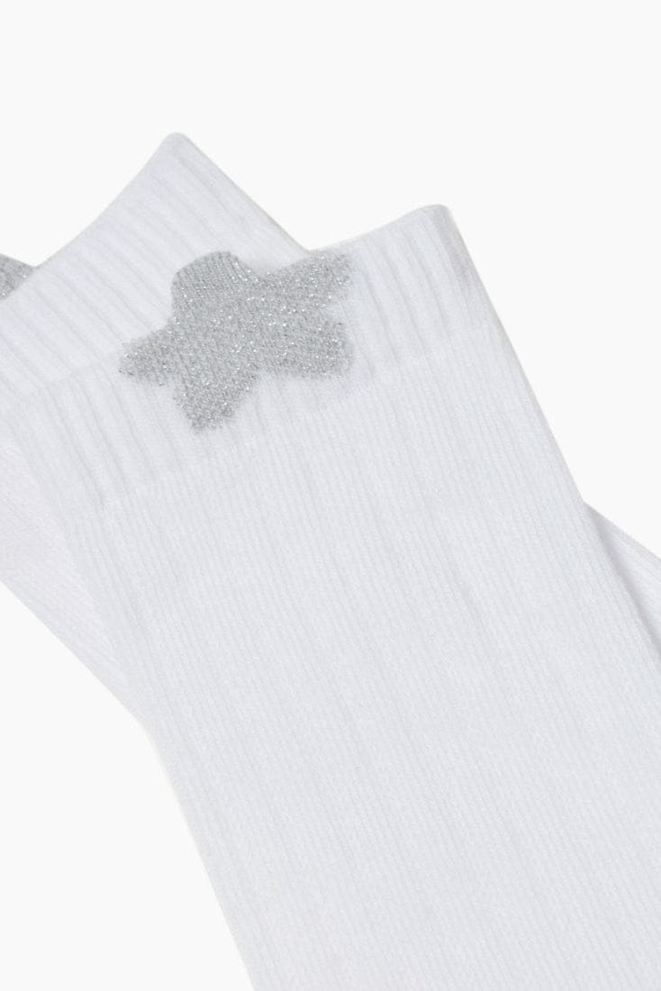 A pair of white ribbed socks featuring a sparkling silver star emblem on the upper side.
