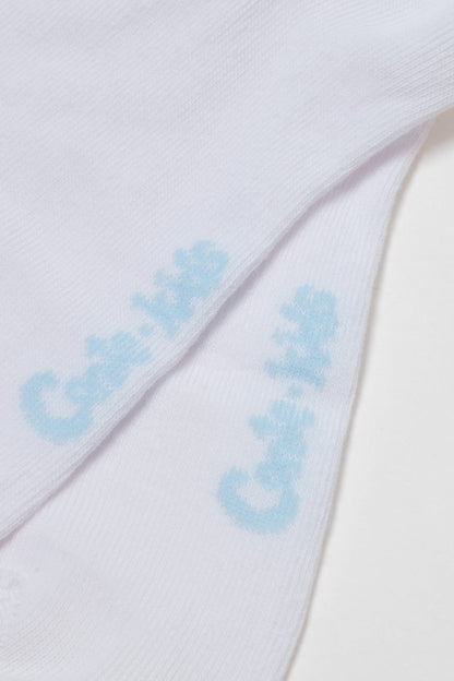 Two folded white socks feature the light blue logo print Cat & Jack on the upper side of each sock.