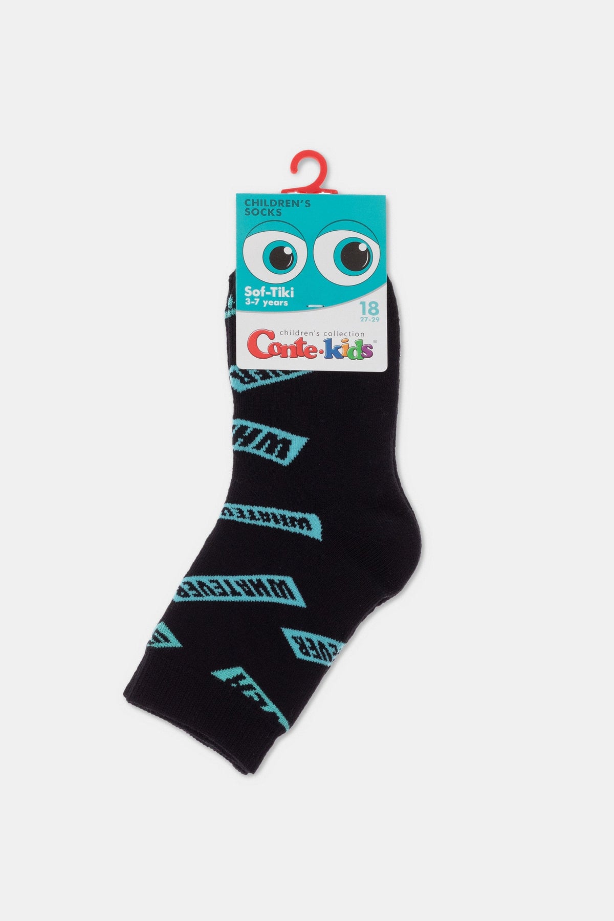 A black children's sock with a repeating light blue graphic pattern of the word whatever, featuring a branded cardboard display header with cartoon eye graphics at the top.