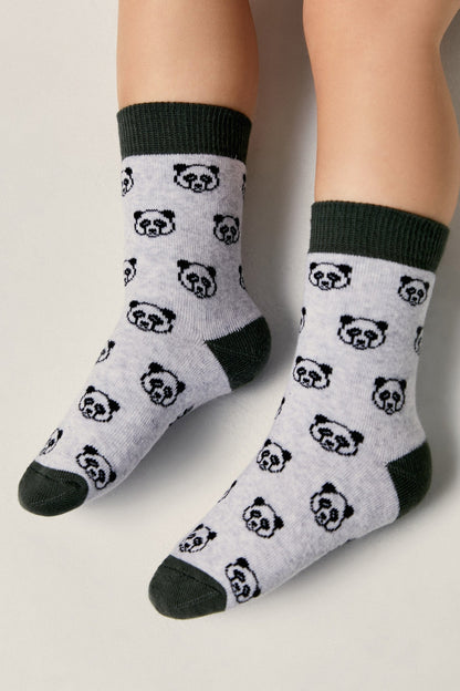 A pair of children's socks in light grey featuring a repeating black panda face pattern with dark green accents on the cuffs, heels, and toes.