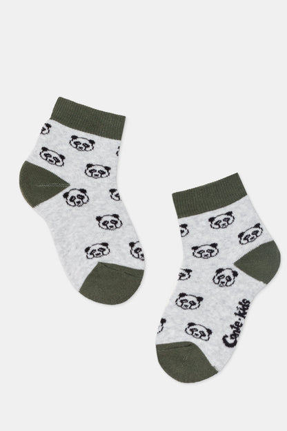 A pair of grey crew-length socks decorated with a repeating pattern of black and white panda faces, featuring dark green cuffs, heels, and toes, with the brand name printed on the bottom of one sock.