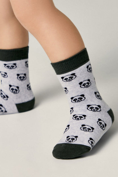 A pair of children's crew socks featuring a light grey base patterned with small black and white panda faces, finished with dark grey cuffs, heels, and toes.