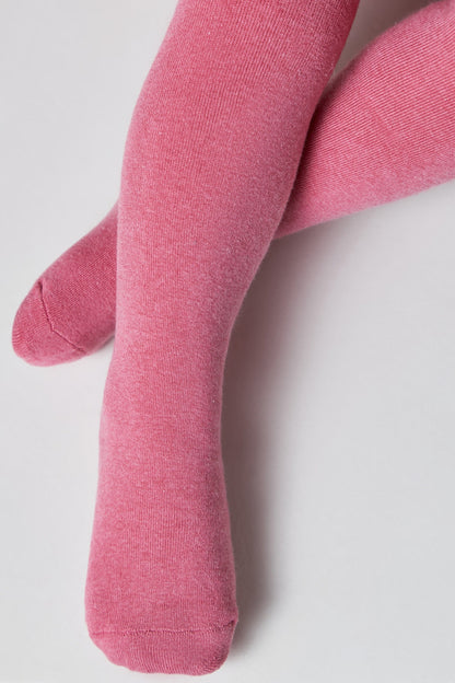 A pair of children's tights in a solid, heathered pink color, displayed with legs crossed against a plain white background.