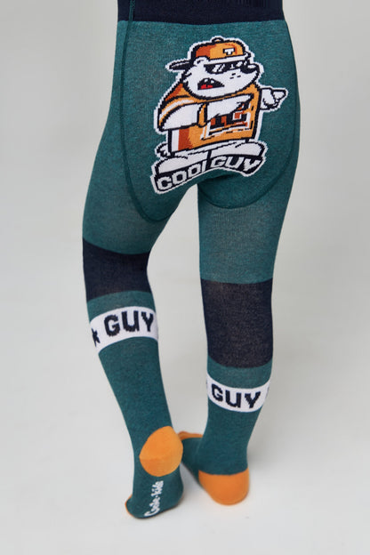 A pair of teal green children's tights with a cartoon bear wearing sunglasses and a cap on the seat, black stripes on the lower legs with the text "GUY" printed on them, and orange heel and toe accents.
