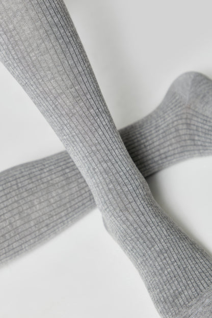 A pair of grey ribbed socks shown against a plain white background.