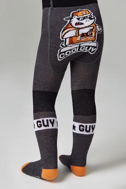 Grey children's tights with an orange and white graphic of a bulldog wearing sunglasses and a cap on the seat, featuring horizontal stripes and the words "COOL GUY" on the lower legs, with orange accents on the toes and heels.