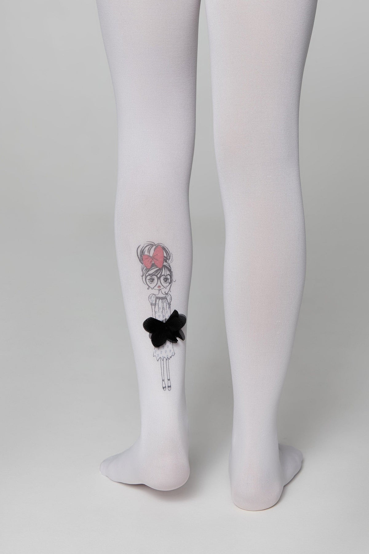 White opaque children's tights featuring a line-art illustration of a girl with a pink hair bow and a small black fabric bow embellishment on the lower left leg.