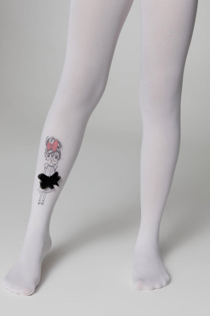 White opaque tights are worn on a pair of legs, featuring a whimsical black and white illustrated girl graphic with a black fabric bow embellishment on the outer side of the right calf.