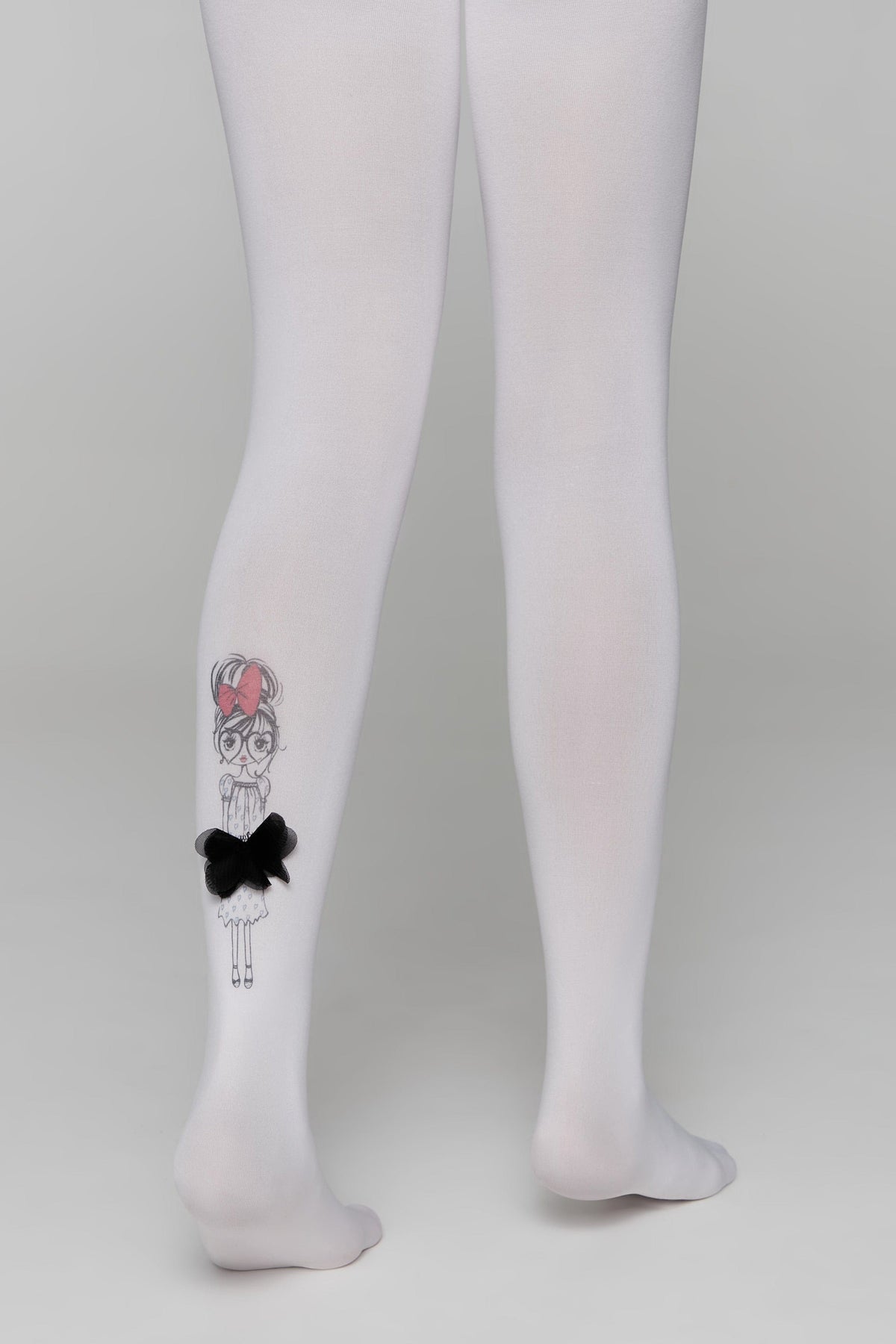 White tights worn on legs, featuring a black and white illustrated girl character with a red bow and a dimensional black fabric bow detail on the lower calf.