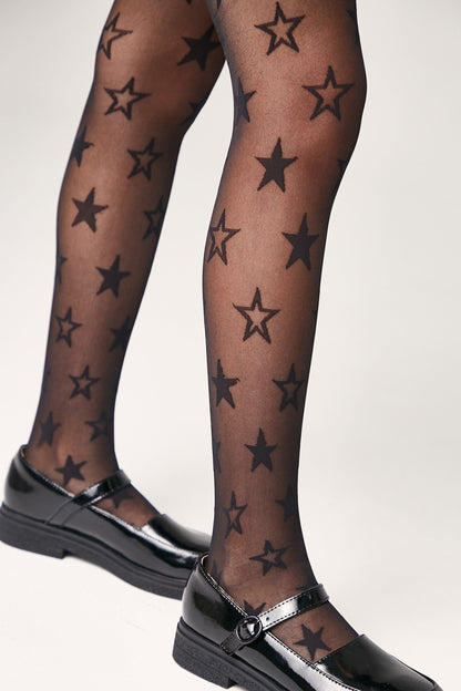 Black sheer tights patterned with various sizes of solid black stars, worn with black patent Mary Jane shoes.