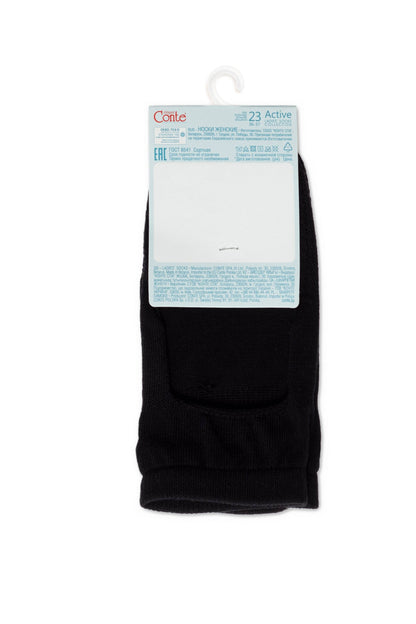 A pair of black ankle socks folded neatly with a white cardboard header attached at the top.